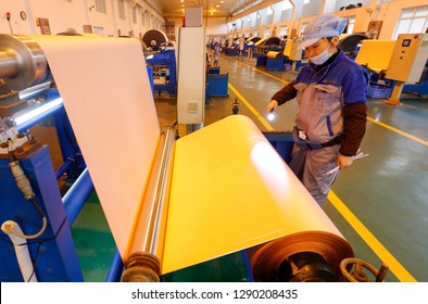 JAINGXI CHINA:January 19, 2019: Workers On A Copper Foil Production Line For Electronic Lithium Batteries In Jiangxi Province. For The First Time, China's GDP Surpassed 90 Trillion Yuan, Up 6.6%.