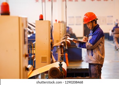 JAINGXI CHINA:January 19, 2019: Workers On A Copper Foil Production Line For Electronic Lithium Batteries In Jiangxi Province. For The First Time, China's GDP Surpassed 90 Trillion Yuan, Up 6.6%.