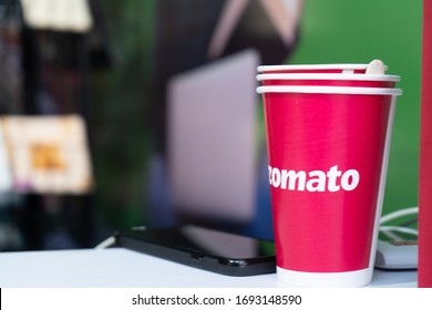 Jaipur, India - Circa 2020 : Red Disposable Cups With The Zomato Logo On Them Stacked For Use At An Event Sponsored By The Indian Food Tech Unicorn. The Food Delivery App Is Now Allowing Consumers To