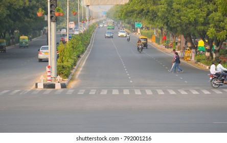 Jaipur, India - November 16, 2017: People Crossing A Busy Road.