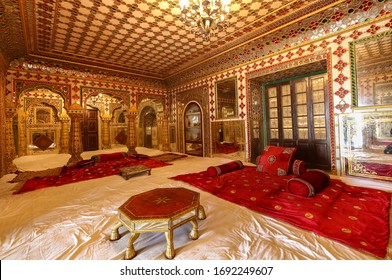 Jaipur, Rajasthan, India, January 6,2020:  City Palace Jaipur view of ancient royal room decorated with precious gems and stones with gold artwork and intricate wall art