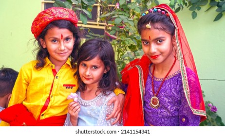 Jaipur, Rajasthan, India, Mar 2022 :  Rajasthani girls before worship to an idol of Isar-Gaura as Lord Shiva and Goddess Parvati on Gangaur festival