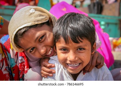 Jaipur, Rajasthan, India -  March 14, 2014 : Portrait of beautiful group of children, smiling and playing in the street in Jaipur city in India