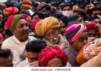 Jaisalmer, India- January 15 2021: People Try To Pass Through The Crowd To Enter The Coronation Ceremony