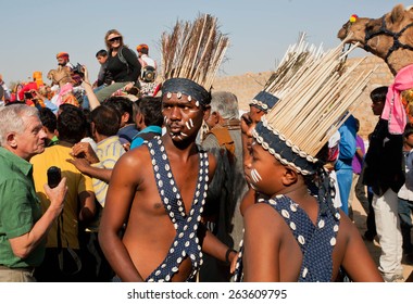 JAISALMER, INDIA - MAR 1: Young weird people from african tribals happy to visit the famous Desert Festival on March 1, 2015 in Rajasthan. Every winter Jaisalmer takes the Desert Festival
