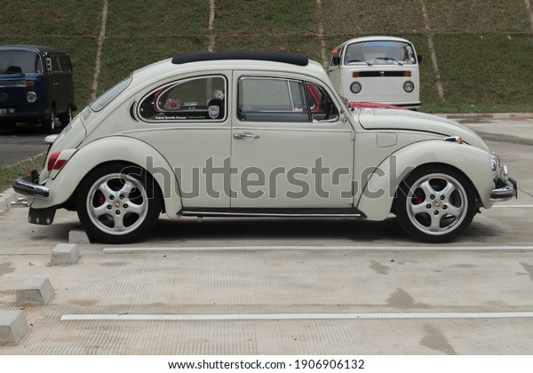 Jakarta Ancol Indonesia\
22 February 2018. Volkswagen Beetle white modification side view\
are shown at parking VW car modification festival at Ancol Summer\
beach. 