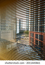 Jakarta Business District Cityscape View From Glass Window With Opened Wooden Blinds