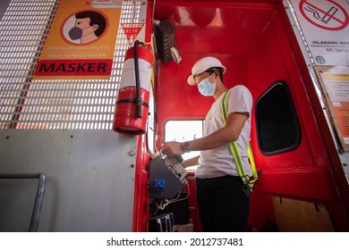 Jakarta, DKI Jakarta Indonesia - April 11 2021 : An Elevator Operator On The Construction Site Of The Jakarta International Stadium In Jakarta, Indonesia