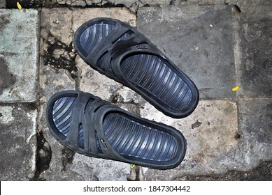 Jakarta, DKI Jakarta / Indonesia - November 2nd 2020 at 1.00pm : A pair of blue Diadora sandal with grey tile on the background