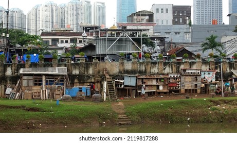 Jakarta, Indonesia - 06 February 2022: Settlements for the poor on the banks of the Ciliwung River, Central Jakarta.                               