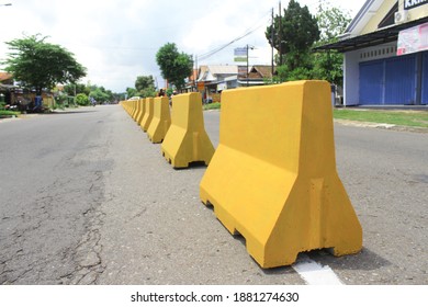 Jakarta, Indonesia, 10 December 2020: Yellow Concrete Roadblock In Jakarta Indonesia