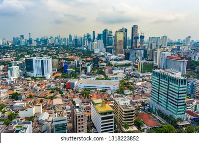 Jakarta, Indonesia - 19th Feb 2019: Aerial or bird eye view of Jakarta Central Business District (Sudirman and Kuningan). Rich and poor inequality. Taken at a cloudy afternoon.