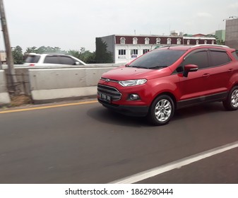 Jakarta, Indonesia, 2020 November 27. A Red Suv Driving Down The Freeway