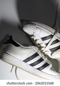 Jakarta - Indonesia, 22 October 2021: Original Adidas Sneakers Shoes With Shoelance On White Floor.