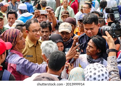 JAKARTA, INDONESIA, 23 JULY 2018: DKI Jakarta Governor Anies Baswedan In The Midst Of A Mass Of Poor People In Jakarta.