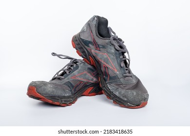 Jakarta, Indonesia, 28-06-2022, Pair Of Old Reebok Shoes On Isolated White Background, Broken Grey Shoe, Old Sneakers, Sport Footwear Sneaker With Broken Sole.