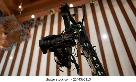 Jakarta, Indonesia - April 09, 2022: A Sony Television Camera On A Crane Outside The Studio. The Video Camera Hanging On The Crane Prepares For A Live Sporting Event. Camera For Live Broadcast 