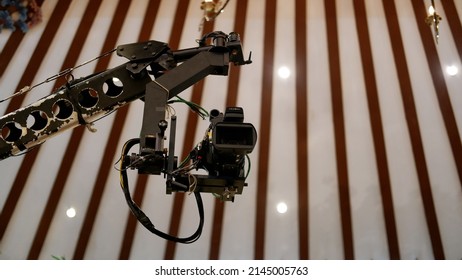 Jakarta, Indonesia - April 09, 2022: A Sony Television Camera On A Crane Outside The Studio. The Video Camera Hanging On The Crane Prepares For A Live Sporting Event. Camera For Live Broadcast 