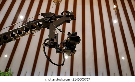 Jakarta, Indonesia - April 09, 2022: A Sony Television Camera On A Crane Outside The Studio. The Video Camera Hanging On The Crane Prepares For A Live Sporting Event. Camera For Live Broadcast 