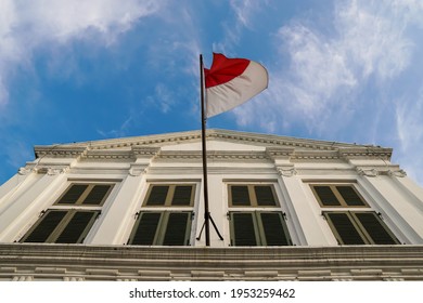 Jakarta, Indonesia - April 10, 2021: The Indonesian National Flag On Top Of The Fatahillah Museum Building Or The Old Dutch Government Building. Photo Of The Building Below The Front