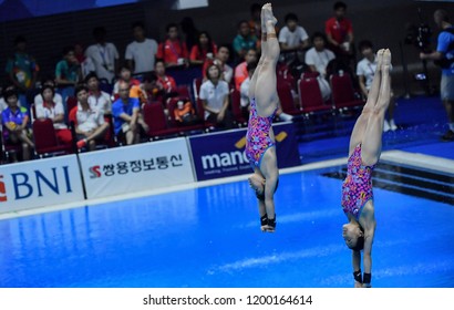 JAKARTA, INDONESIA - AUGUST 18, 2018 : Japan Diving Athlete Compete In Women's Synchronised 10m Platform Diving Final On The 2018 Asian Games In Jakarta.