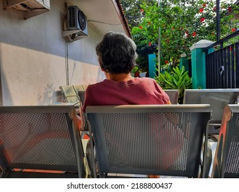 Jakarta, Indonesia, August 2, 2022 Patients Sit On The Bench Waiting For The Doctor In A Public Health Center Or Puskesmas.