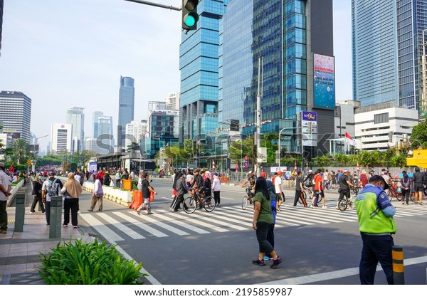 Jakarta, Indonesia - August, 2022 : \
The\
situation on Sunday morning at the car free day event on the\
protocol road, Jalan Jenderal\
Sudirman.