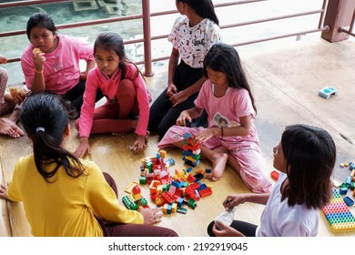 Jakarta, Indonesia - August 23 2022: The Child Is Playing Lego Outside The Yard Of The House 