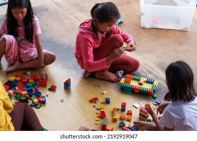 Jakarta, Indonesia - August 23 2022: The Child Is Playing Lego Outside The Yard Of The House 