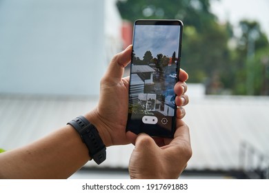 Jakarta, Indonesia - February 16, 2021: Photographer take photos using the Samsung Galaxy S21 Ultra flagship smartphone.