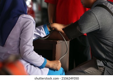 Jakarta  Indonesia - February 21, 2019 : Selective Focus Medical Workers Check Blood Pressure
An Employee For Medical Check Up In Jakarta, Indonesia. 