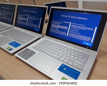 Jakarta, Indonesia - February 4th, 2021: Some laptops with Windows 10 license agreement on screen