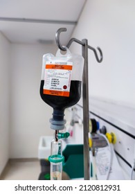 Jakarta, Indonesia - Jan 2022: Close Up Of IV Plastic Bag With Drip Chamber In Recovery Room At Intensive Care Unit Of Hospital With Bokeh Background. No People.