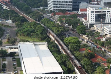 Jakarta, Indonesia - January 19, 2022: Jakarta Commuter Line (train) Arrive At Gambir Railway Station, Central Jakarta.