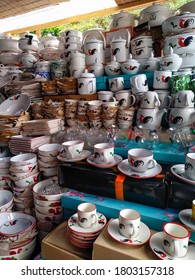 Jakarta Indonesia- July 2020:  Street Vendor's Stall Sells Various Glass Ware And China Ware  With Jago (cock) Pattern