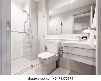 JAKARTA, INDONESIA - July 24, 2024: Clean, white, and minimalistic bathroom in Jakarta, Indonesia on July 24, 2024. - Powered by Shutterstock