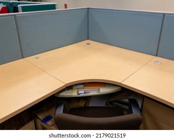 Jakarta, Indonesia - July 3, 2022: An Empty Cubicle Desk With Light Blue Partition And A Dark Brown Chair.