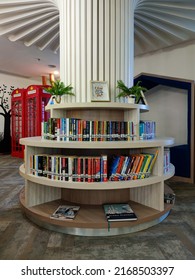 Jakarta, Indonesia - Jun 2022: View Of Neatly Arranged Books On Tiered And Circular Bookshelves Style With Decorative Plant. No People.