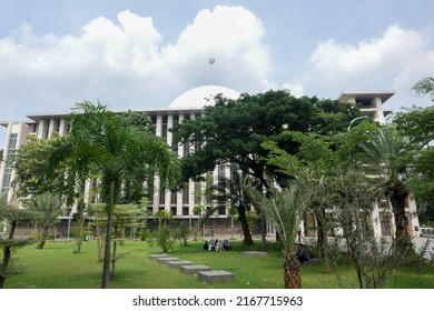 Jakarta, Indonesia - June 10 2022: Istiqlal Grand Mosque Seen From The Side. There Is A Green Garden With A Nice View. Suitable For Religious Tourism In The City.