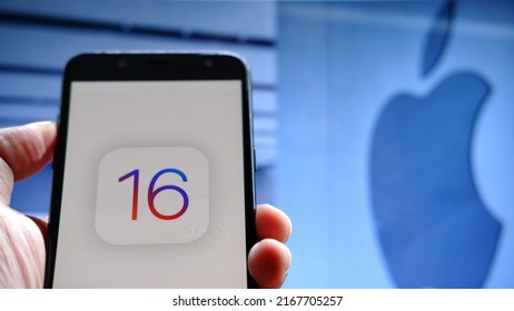 Jakarta, Indonesia - June 14, 2022: IOS 16 Logo Displayed On A Smartphone With An Apple Logo In The  Background