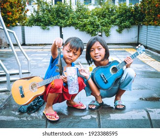 Jakarta, Indonesia - June 16, 2020 : A Photograph Two Street Singers