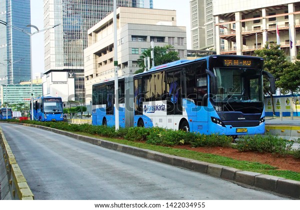 Jakarta, Indonesia June 6, 2019 :Jakarta Bus Rapid\
Transit (BRT) called as Transjakarta is  a public transportation in\
Jakarta. The first BRT in south east Asia start operations in\
January 2004.     