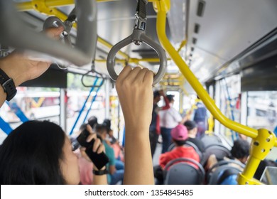 JAKARTA - Indonesia. March 20, 2019: Crowded Passengers Holding Handle On The Transjakarta Bus