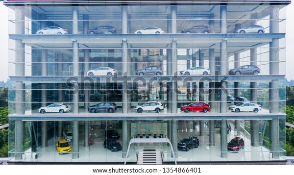 JAKARTA -
Indonesia. March 25, 2019: 
 Aerial view of Honda car showroom
building with cars displayed on the
window