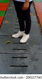 Jakarta, Indonesia - March 30, 2021 : A Man Wearing Converse Shoes On The Street, During The Day