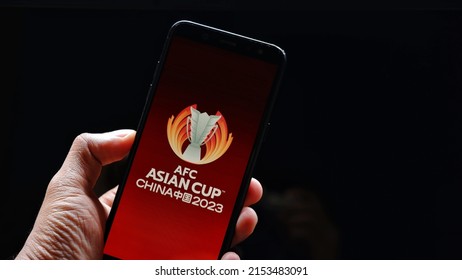 Jakarta, Indonesia - May 07, 2022: Asian Football Confederation Championship China 2023 Logo Display On Smartphone With Dark Background. AFC Championship China 2023 Logo On Smartphone 
