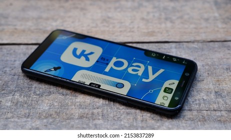 Jakarta, Indonesia - May 08, 2022: VK Pay logo display on smartphone with wooden background 