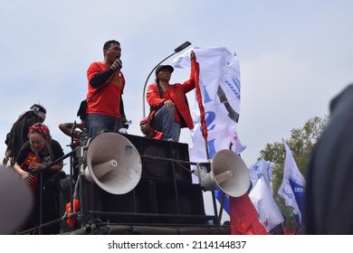 Jakarta, Indonesia – May, 1, 2015: Trade union representatives talk over the car. He protested on international labor day