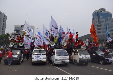 Jakarta, Indonesia – May, 1, 2015: Trade unions talking over cars. They protested on international labor day
