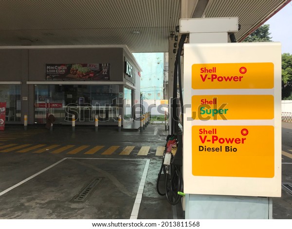 Jakarta, Indonesia - May 17, 2021:\
Shell V-power signboard at the Shell fuel station in Asia. Royal\
Dutch Shell is an Anglo-Dutch multinational oil and gas company.\
